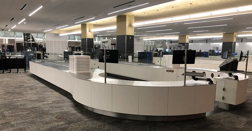 Completed curved baggage claim carousel in a finished airport terminal